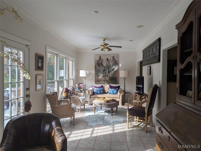 tiled living room featuring ceiling fan and crown molding