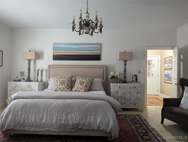 carpeted bedroom featuring crown molding and an inviting chandelier