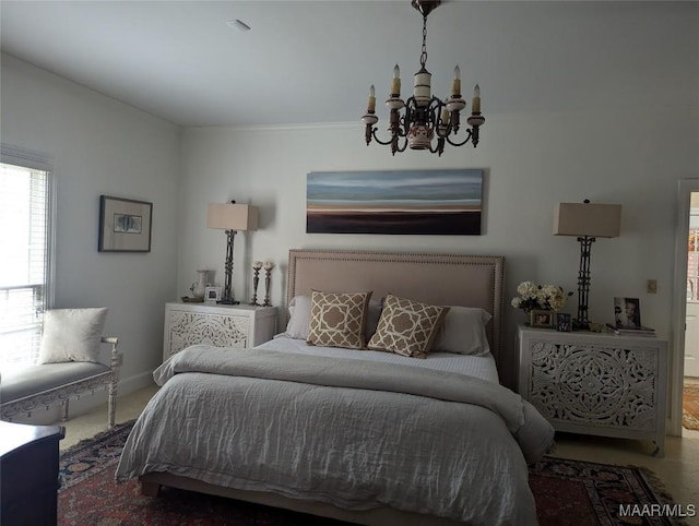 carpeted bedroom featuring a chandelier