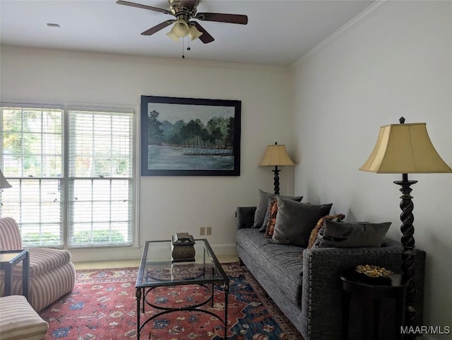 living room with crown molding, plenty of natural light, and ceiling fan