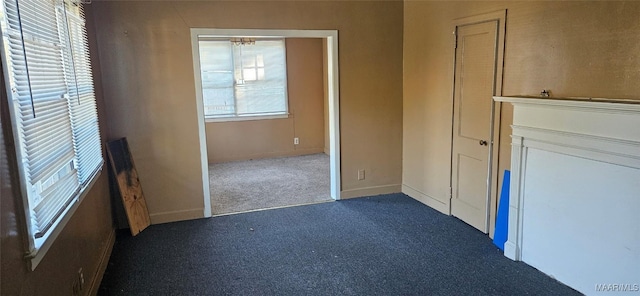 interior space featuring dark carpet