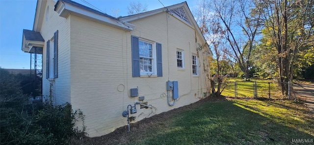 view of property exterior with a yard