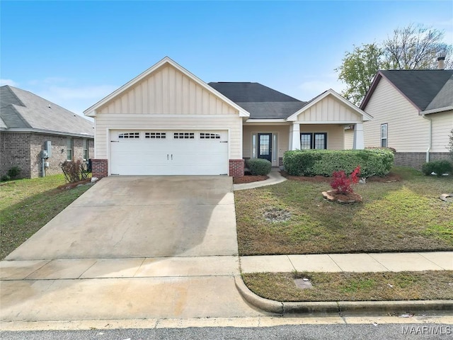 view of front of home featuring a front lawn and a garage