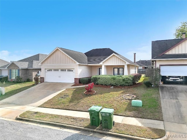 view of front of home with a garage and a front yard