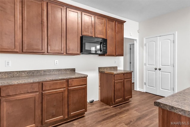 kitchen featuring dark hardwood / wood-style flooring