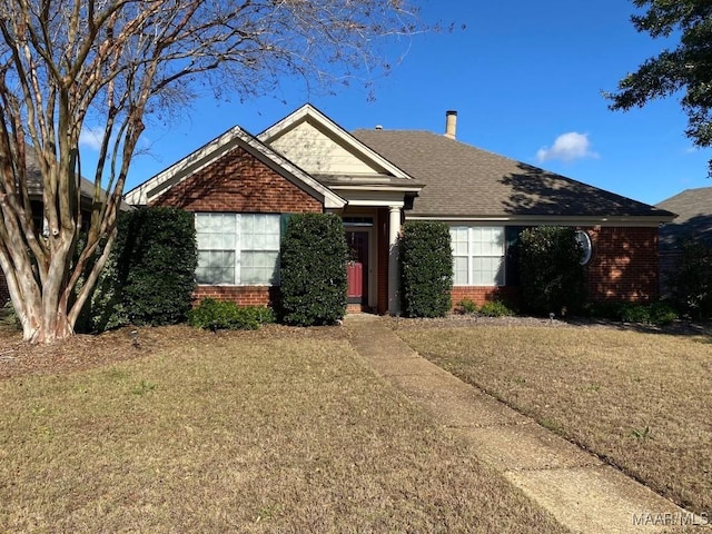 view of front of home with a front yard