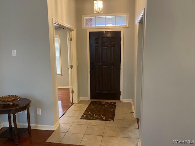 foyer entrance featuring light tile patterned flooring