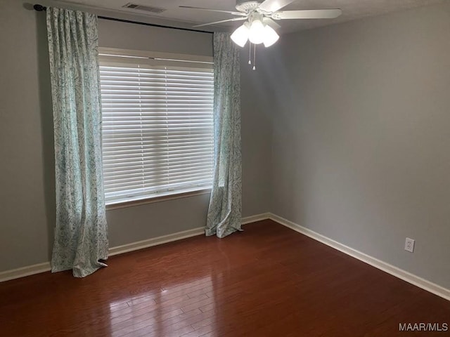 unfurnished room with wood-type flooring and ceiling fan