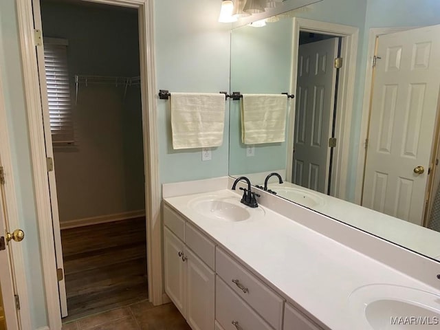 bathroom with tile patterned flooring and vanity