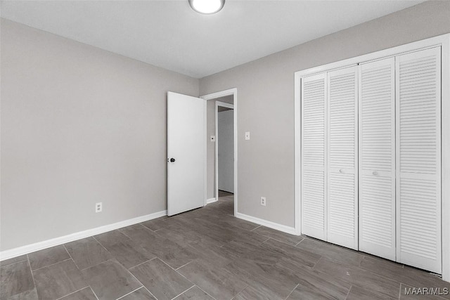 unfurnished bedroom featuring a closet