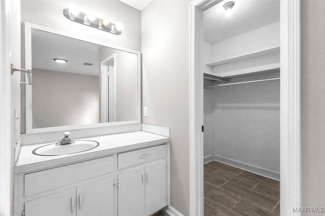 bathroom featuring vanity and hardwood / wood-style flooring