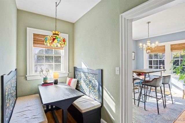 dining room with a notable chandelier and wood-type flooring