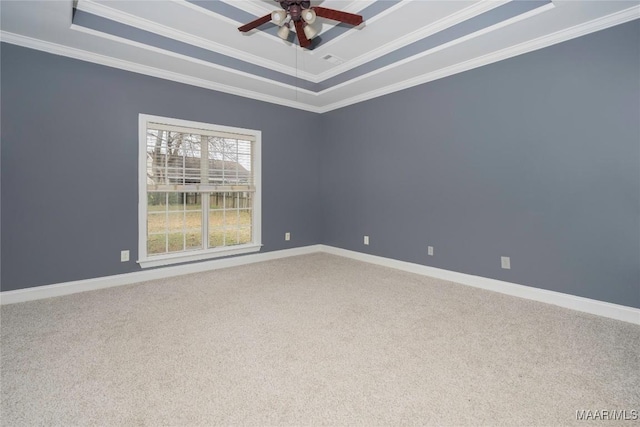 unfurnished room with carpet, a raised ceiling, and ornamental molding