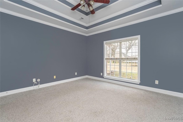 unfurnished room featuring carpet flooring, a tray ceiling, and ornamental molding