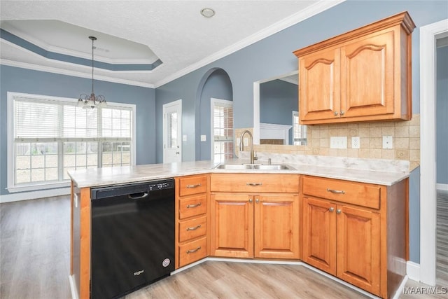 kitchen with ornamental molding, sink, an inviting chandelier, dishwasher, and light hardwood / wood-style floors