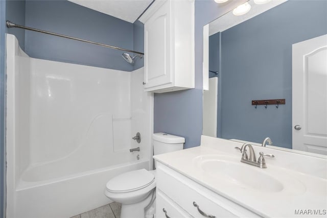 full bathroom with vanity, shower / washtub combination, tile patterned flooring, toilet, and a textured ceiling