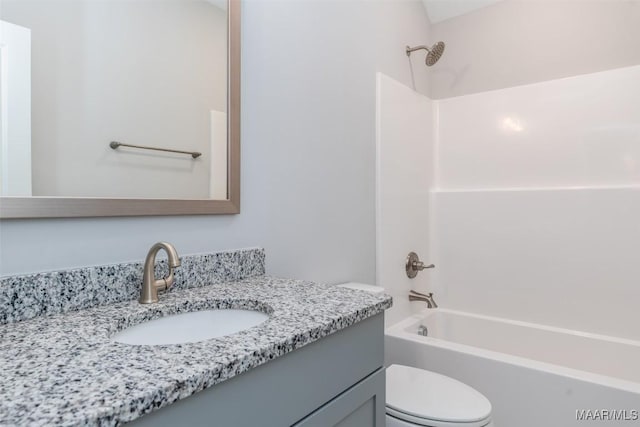 bathroom featuring toilet, shower / tub combination, and vanity