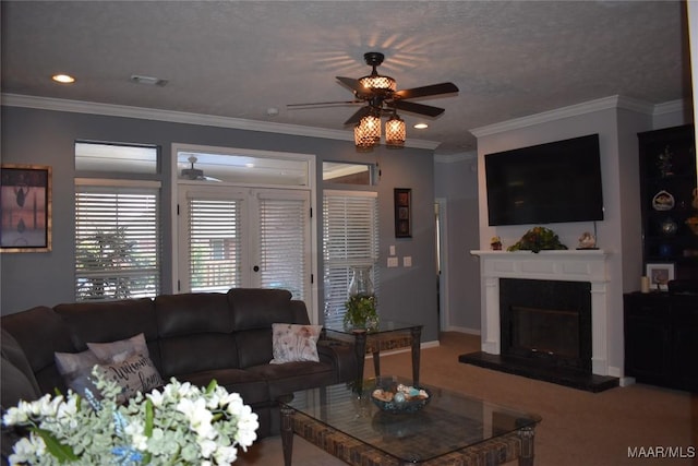 carpeted living room with french doors, a textured ceiling, ceiling fan, and ornamental molding