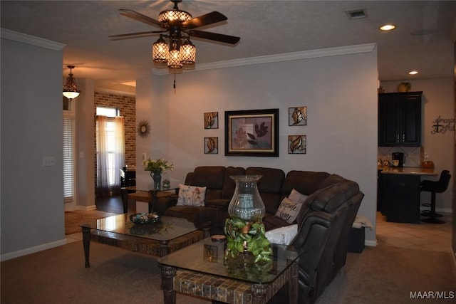 carpeted living room with ceiling fan and ornamental molding