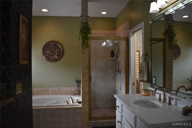 bathroom with vanity and independent shower and bath