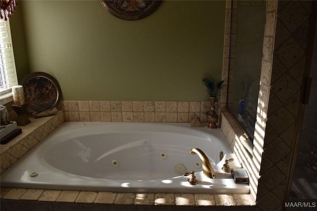 bathroom featuring tiled tub