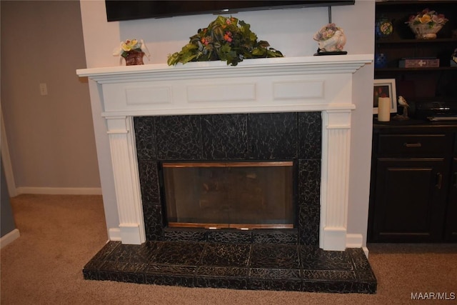 room details featuring carpet floors and a fireplace