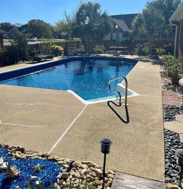 view of pool featuring a patio