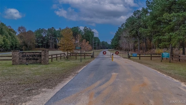 2065 Robinson Pond Rd, Prattville, AL 36067 - view of street featuring a gate and a forest view