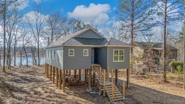 view of front of house featuring a carport and a water view