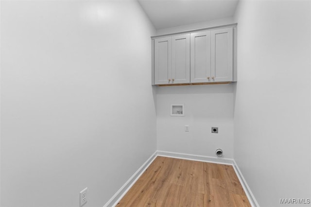 2065 Robinson Pond Rd, Prattville, AL 36067 - laundry area with light wood-style floors, baseboards, electric dryer hookup, cabinet space, and washer hookup