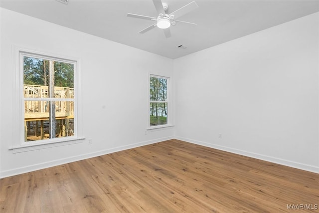 2065 Robinson Pond Rd, Prattville, AL 36067 - empty room with wood finished floors, visible vents, baseboards, and ceiling fan