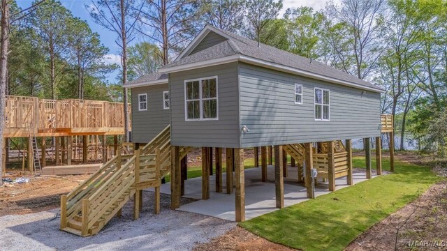 2065 Robinson Pond Rd, Prattville, AL 36067 - exterior space with stairway, a patio area, driveway, a carport, and roof with shingles