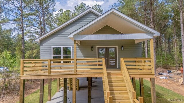 2065 Robinson Pond Rd, Prattville, AL 36067 - rear view of property featuring a carport, a wooden deck, french doors, and stairs