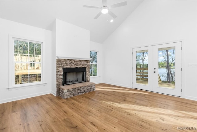 2065 Robinson Pond Rd, Prattville, AL 36067 - unfurnished living room with plenty of natural light, a fireplace, french doors, and high vaulted ceiling