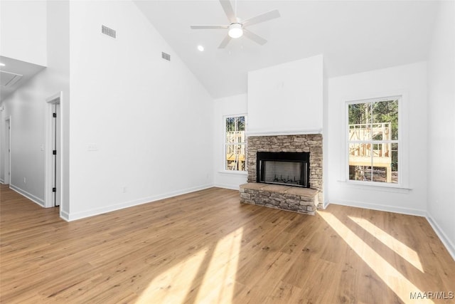 2065 Robinson Pond Rd, Prattville, AL 36067 - unfurnished living room with attic access, a healthy amount of sunlight, high vaulted ceiling, and a fireplace