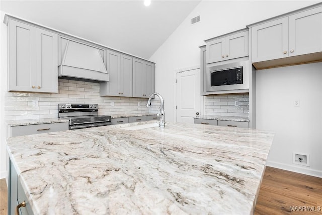 2065 Robinson Pond Rd, Prattville, AL 36067 - kitchen featuring a sink, built in microwave, stainless steel range with electric cooktop, gray cabinets, and custom range hood