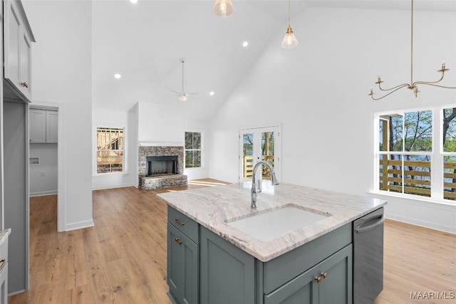 2065 Robinson Pond Rd, Prattville, AL 36067 - kitchen with stainless steel dishwasher, a sink, ceiling fan, decorative light fixtures, and high vaulted ceiling