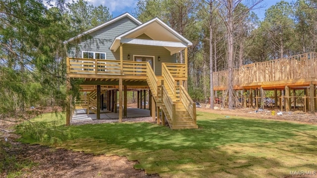 2065 Robinson Pond Rd, Prattville, AL 36067 - view of play area with a lawn, a patio, stairs, and a deck
