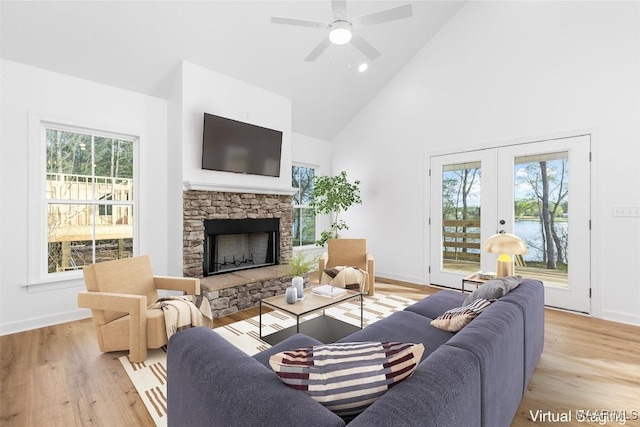 2065 Robinson Pond Rd, Prattville, AL 36067 - living room with light wood-type flooring, a fireplace, baseboards, and high vaulted ceiling