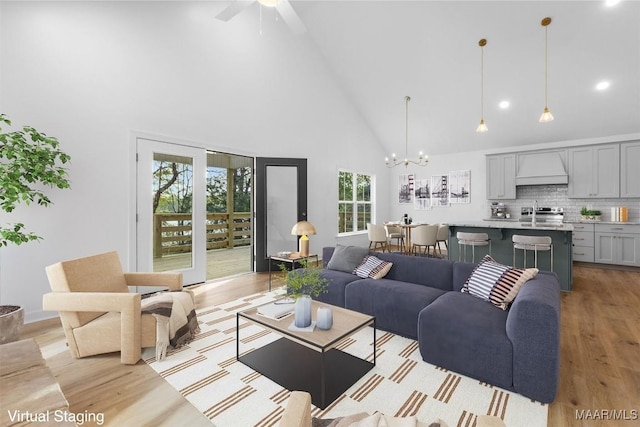 2065 Robinson Pond Rd, Prattville, AL 36067 - living area featuring high vaulted ceiling, recessed lighting, light wood finished floors, and ceiling fan with notable chandelier