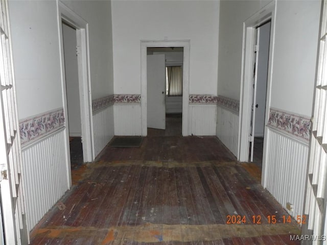 corridor with dark wood-type flooring