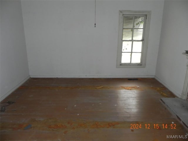 unfurnished room with hardwood / wood-style floors