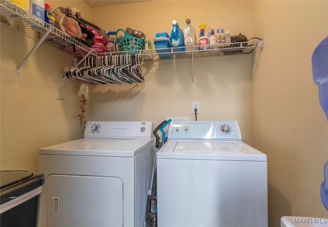 washroom with separate washer and dryer