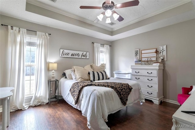 bedroom with ceiling fan, dark wood-type flooring, and multiple windows