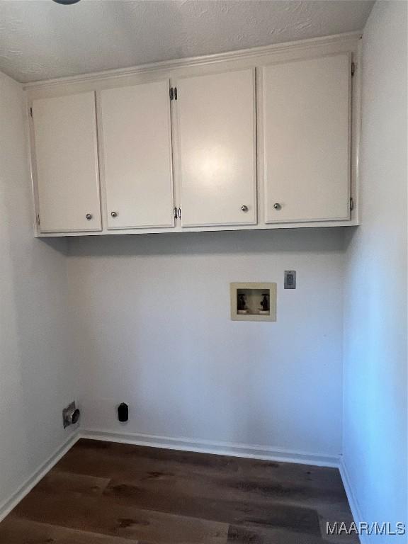 laundry room with hookup for a washing machine, dark hardwood / wood-style flooring, cabinets, and hookup for an electric dryer