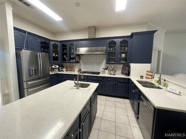 kitchen featuring blue cabinetry, stainless steel appliances, range hood, and sink