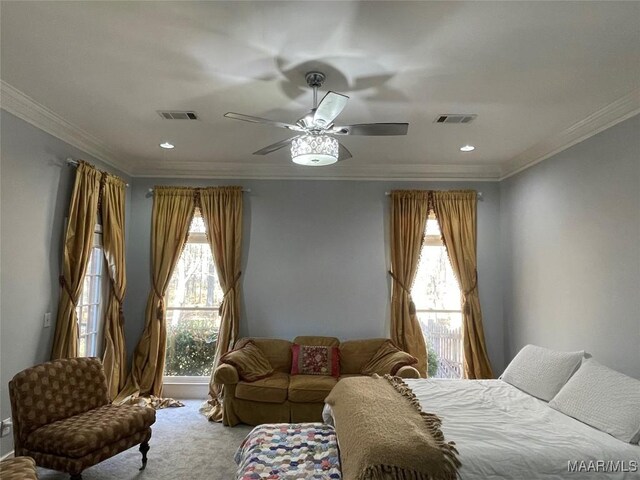 bedroom featuring multiple windows, ceiling fan, and ornamental molding