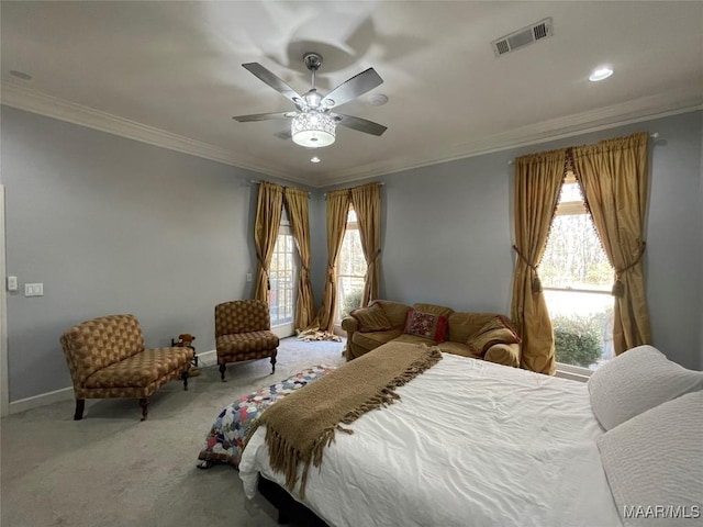 bedroom featuring carpet flooring, ceiling fan, crown molding, and multiple windows