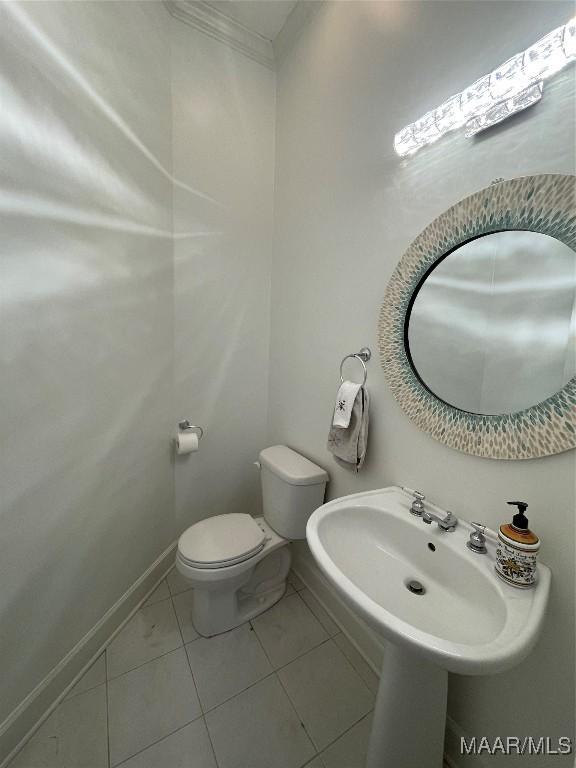 bathroom with tile patterned floors and toilet