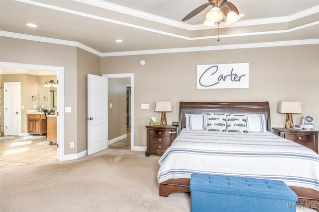 carpeted bedroom featuring ensuite bath, ceiling fan, and crown molding